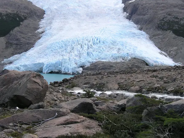 The glacier reaching the lake